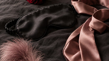 A black satin blindfold