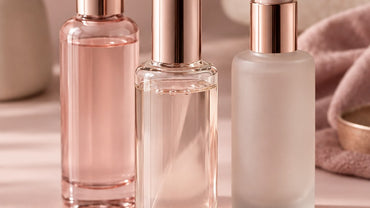 Three minimalist unbranded lubricant bottles in clear