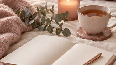 An open journal with a pen